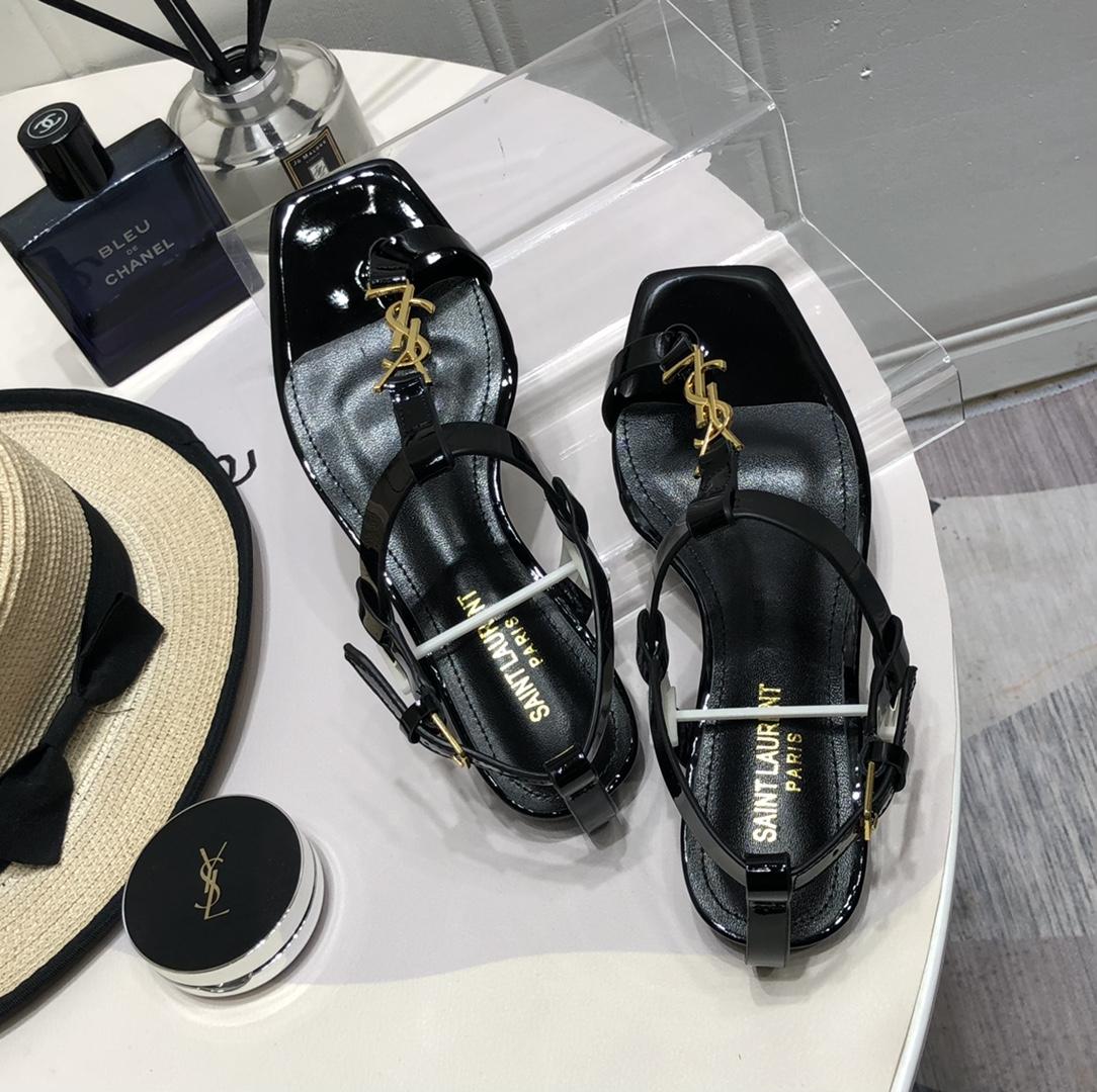 Saint Laurent Cassandra Flat Sandals In Patent Leather With Gold-Tone Monogram - DopestKickz