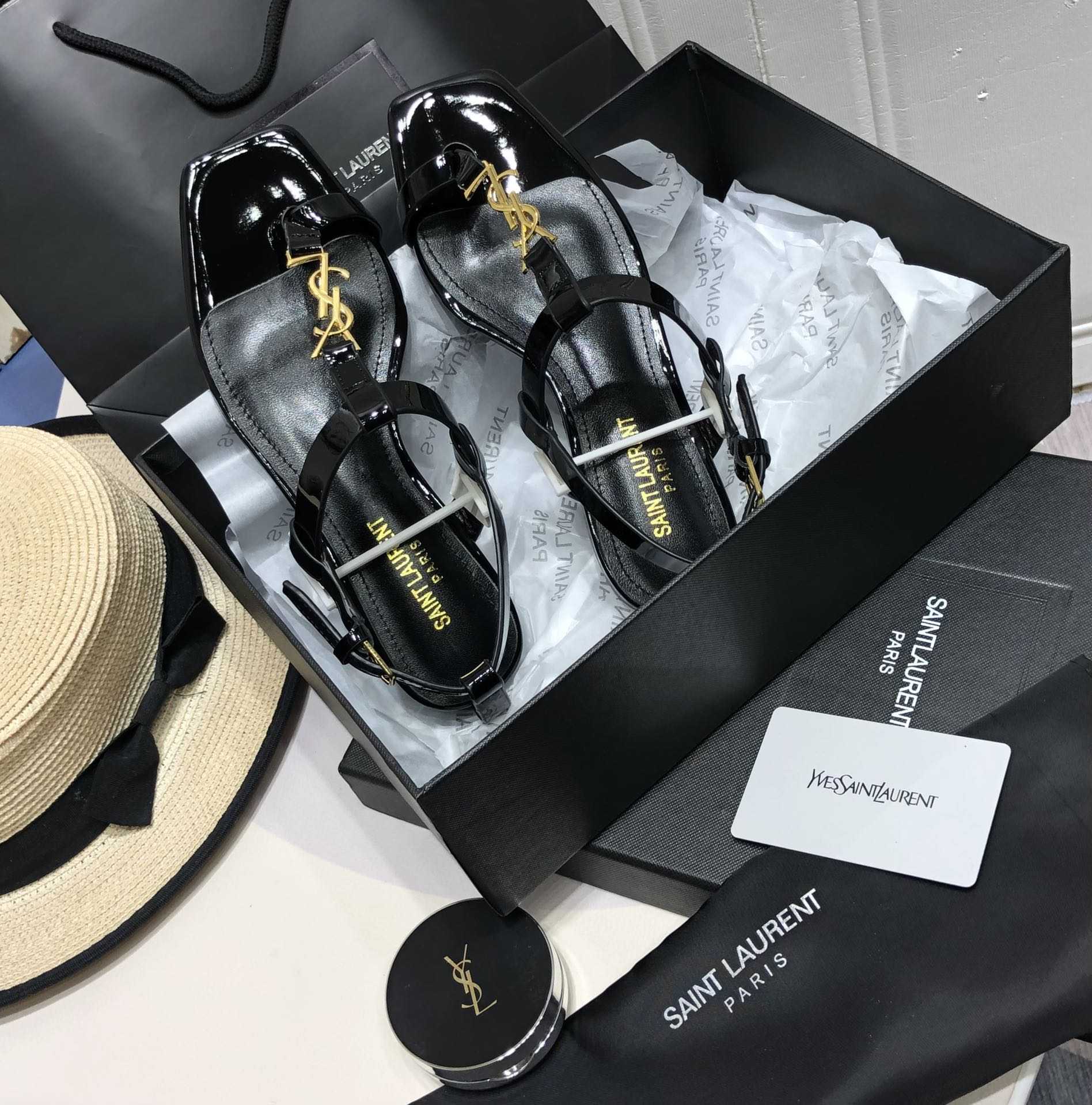 Saint Laurent Cassandra Flat Sandals In Patent Leather With Gold-Tone Monogram - DopestKickz