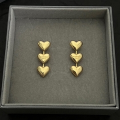Balenciaga Women's Heart Earrings In Gold - DopestKickz