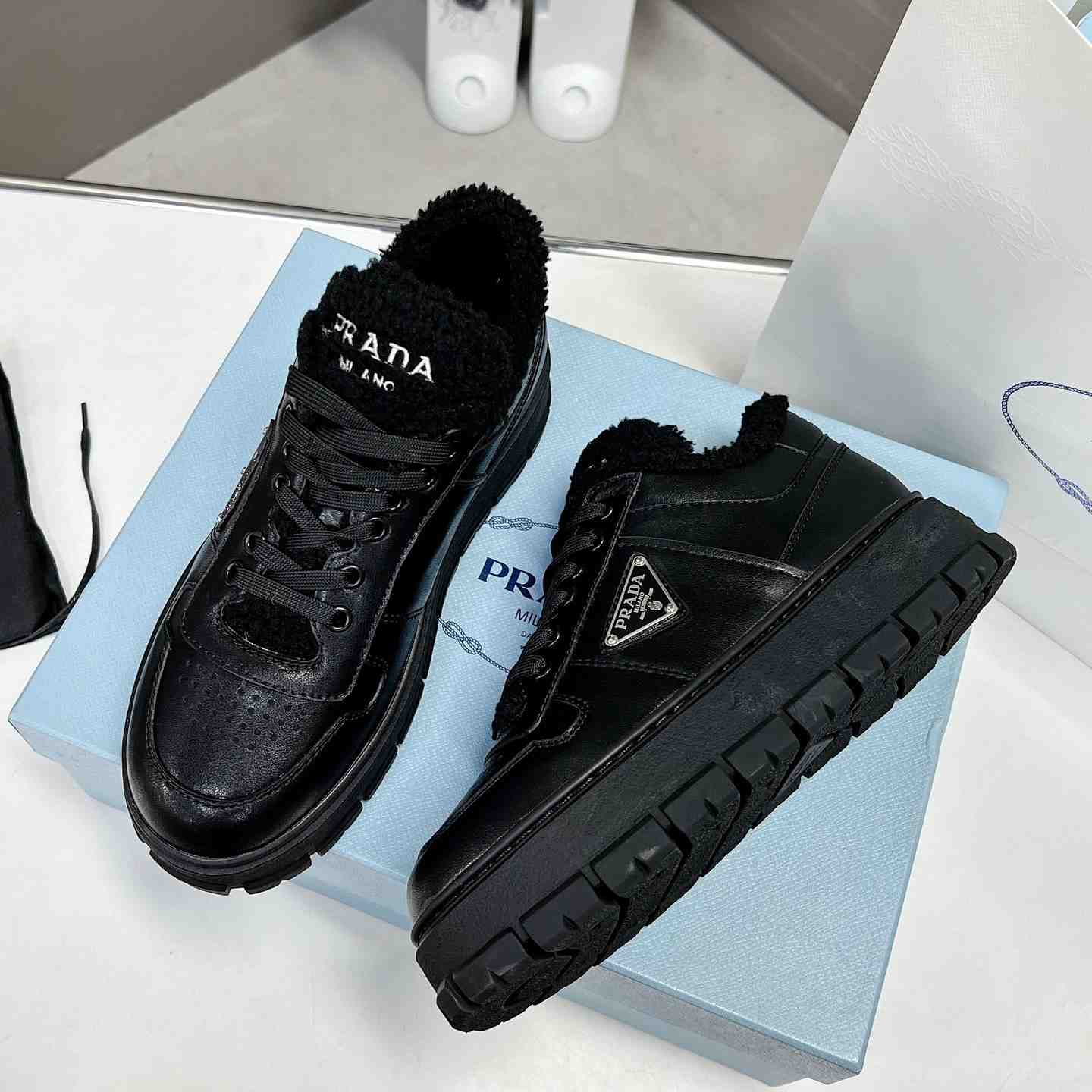 Prada Leather And Shearling Sneakers - DopestKickz