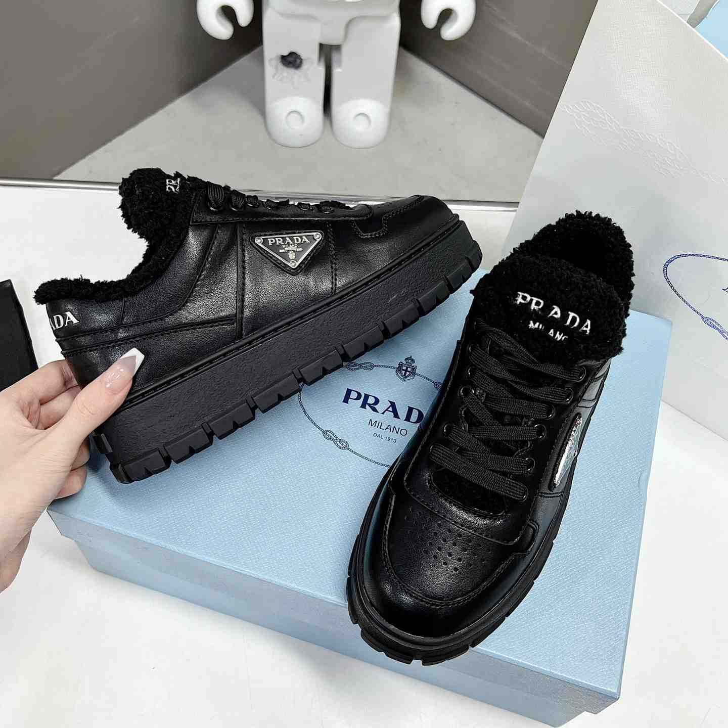 Prada Leather And Shearling Sneakers - DopestKickz