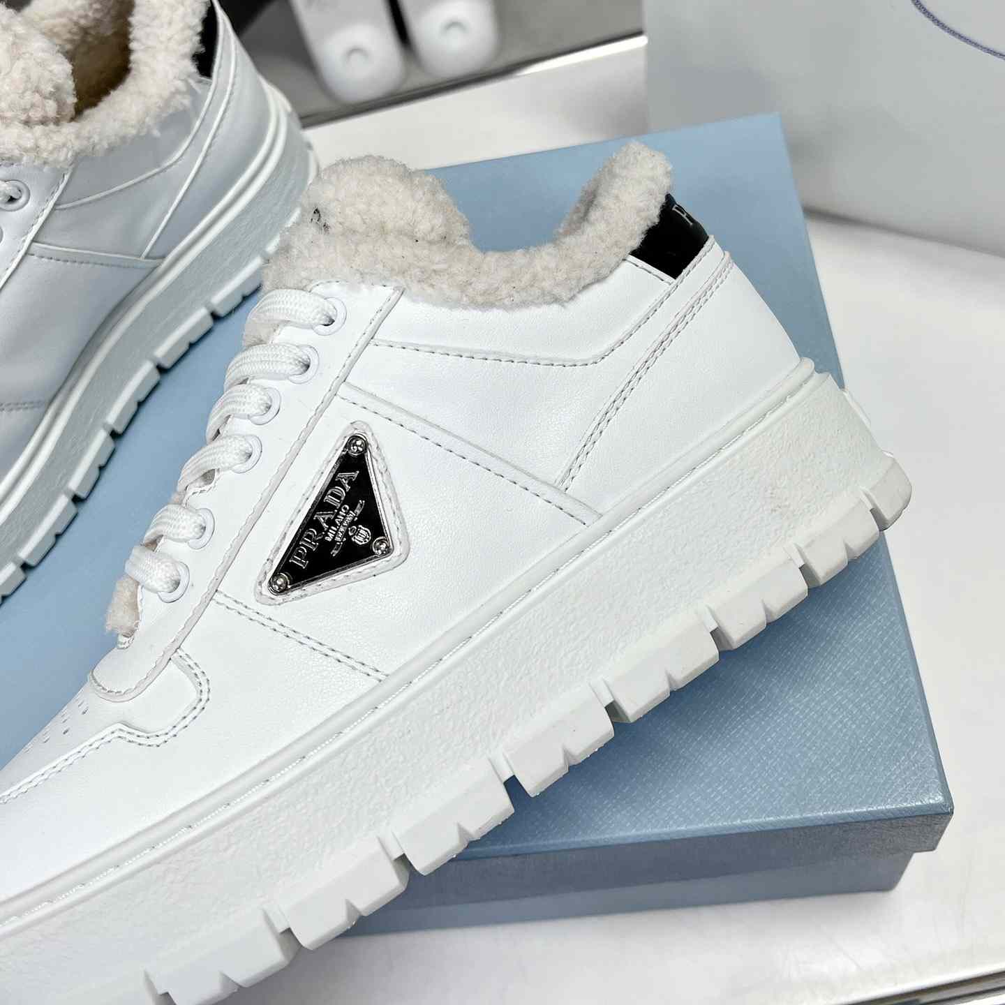 Prada Leather And Shearling Sneakers - DopestKickz
