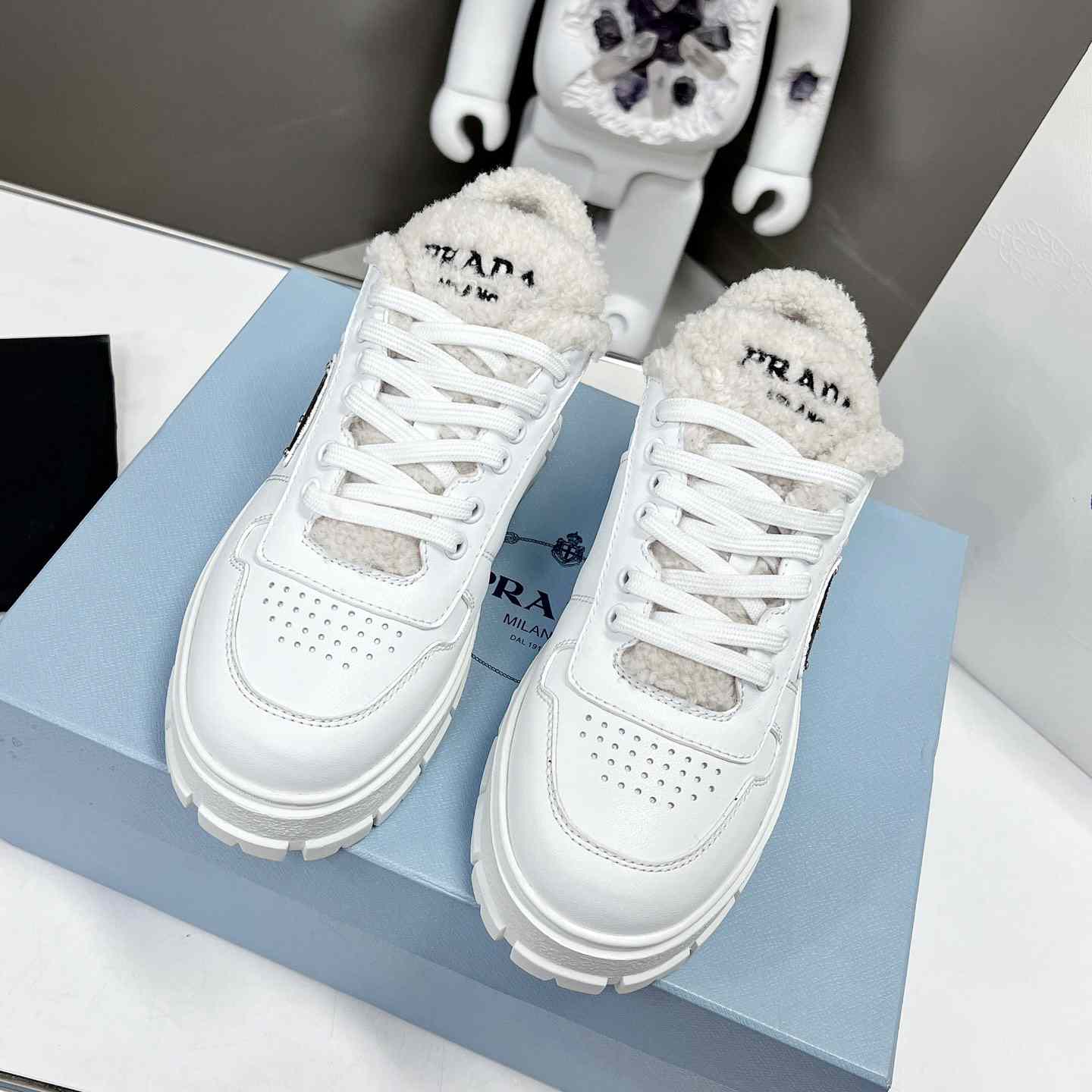 Prada Leather And Shearling Sneakers - DopestKickz