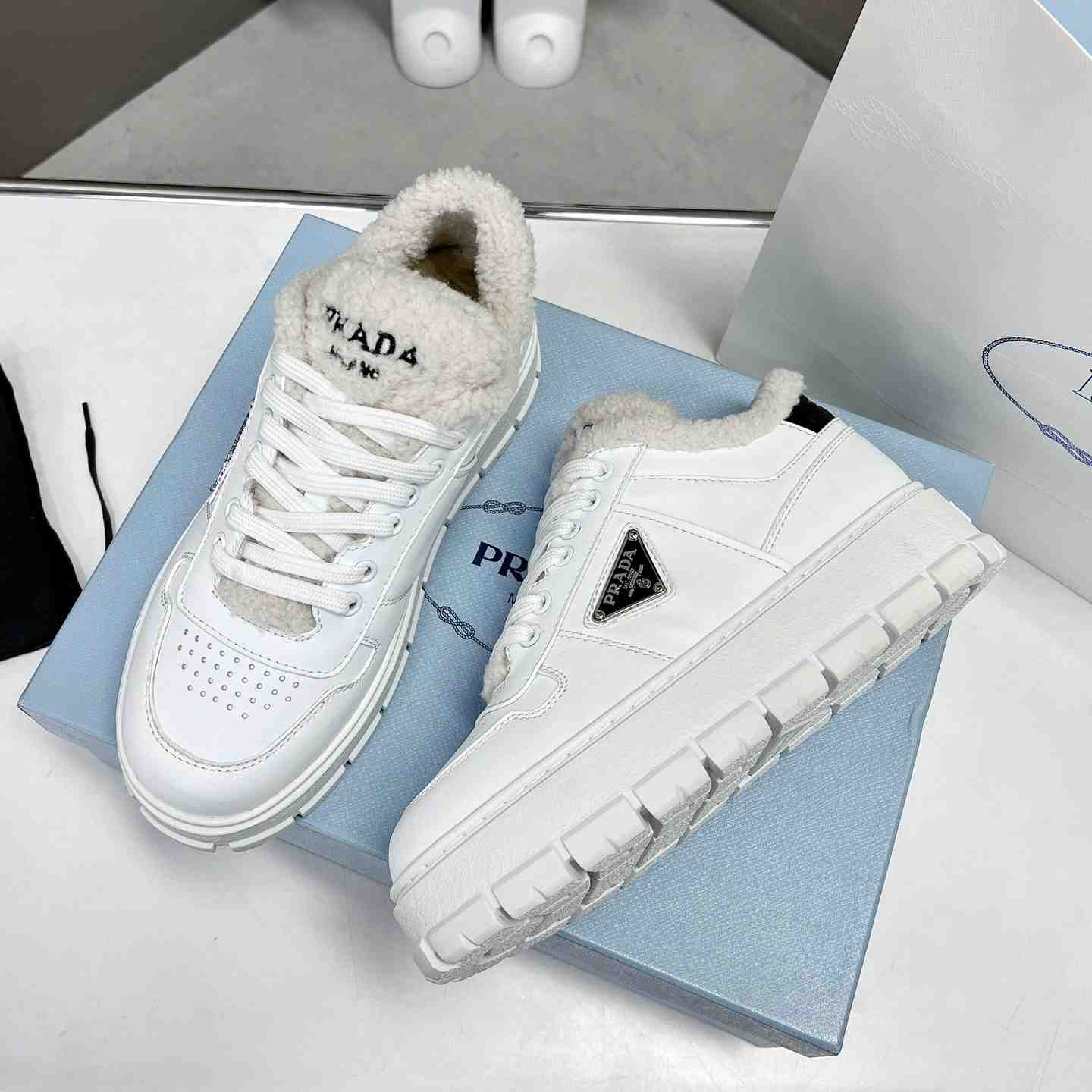 Prada Leather And Shearling Sneakers - DopestKickz
