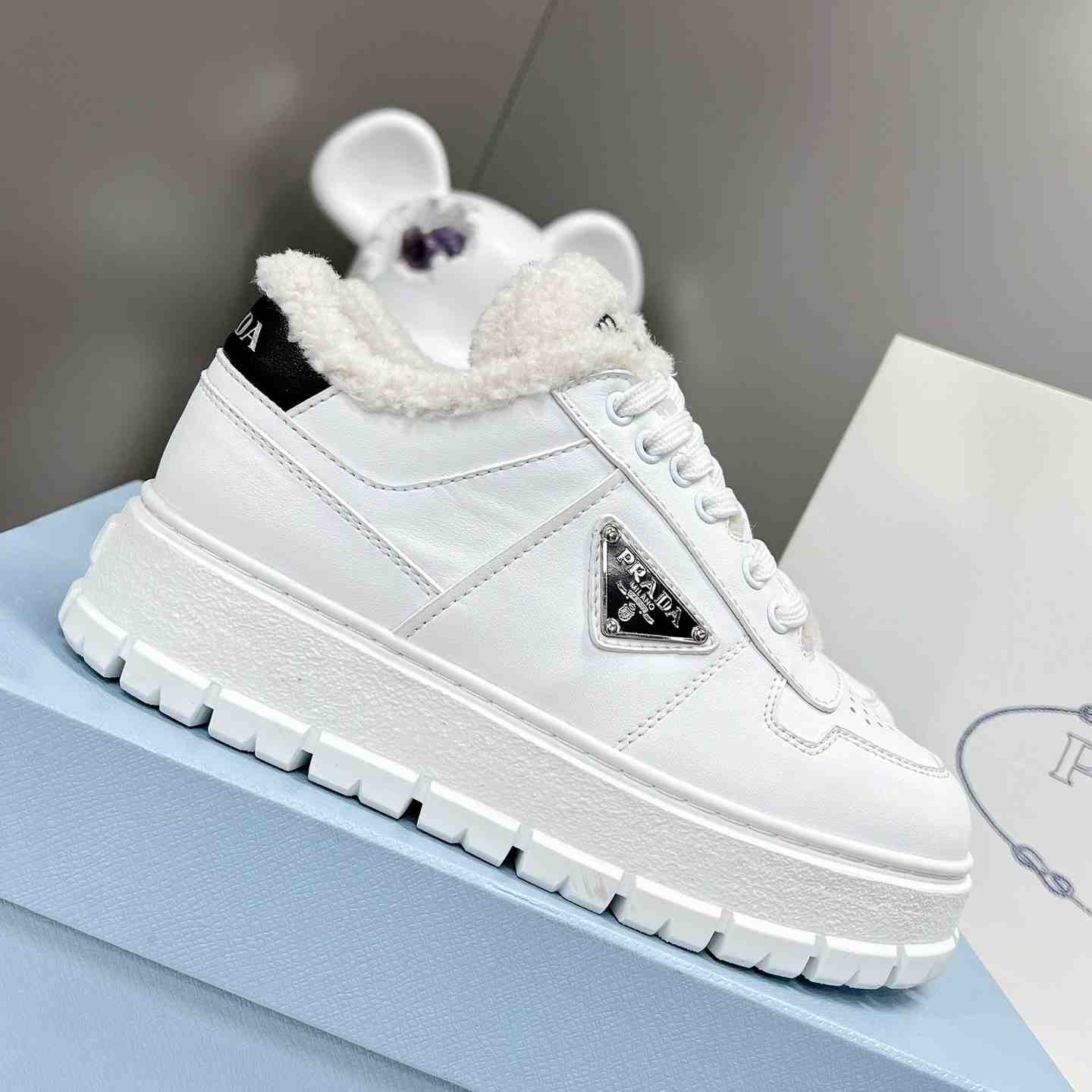 Prada Leather And Shearling Sneakers - DopestKickz