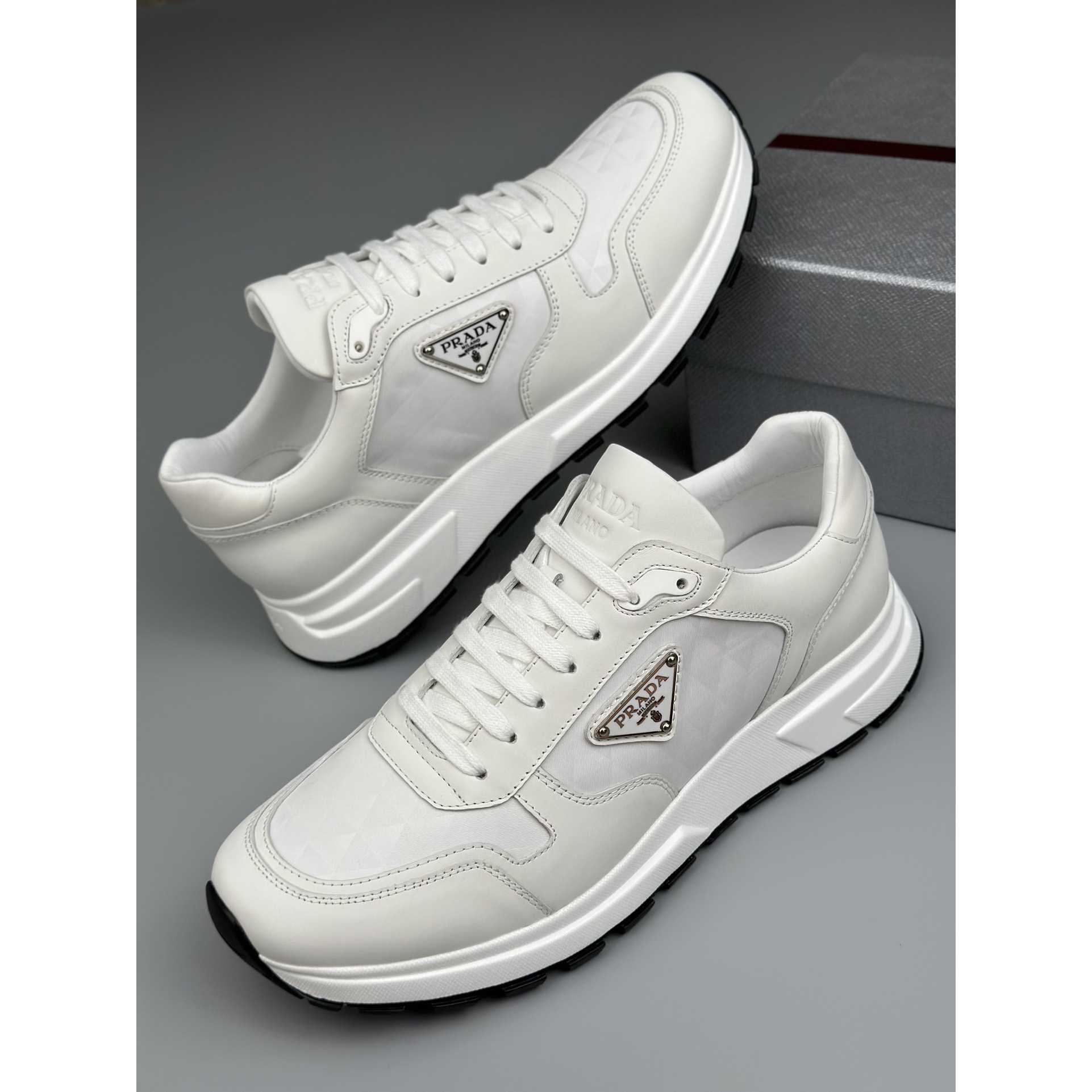 Prada Leather And Re-Nylon High-top Sneakers - DopestKickz