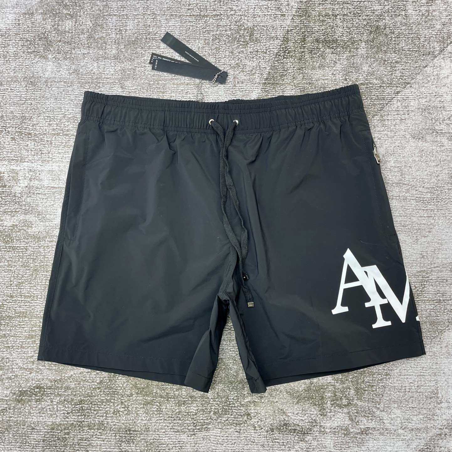 Amiri Staggered Swim Trunk - DopestKickz