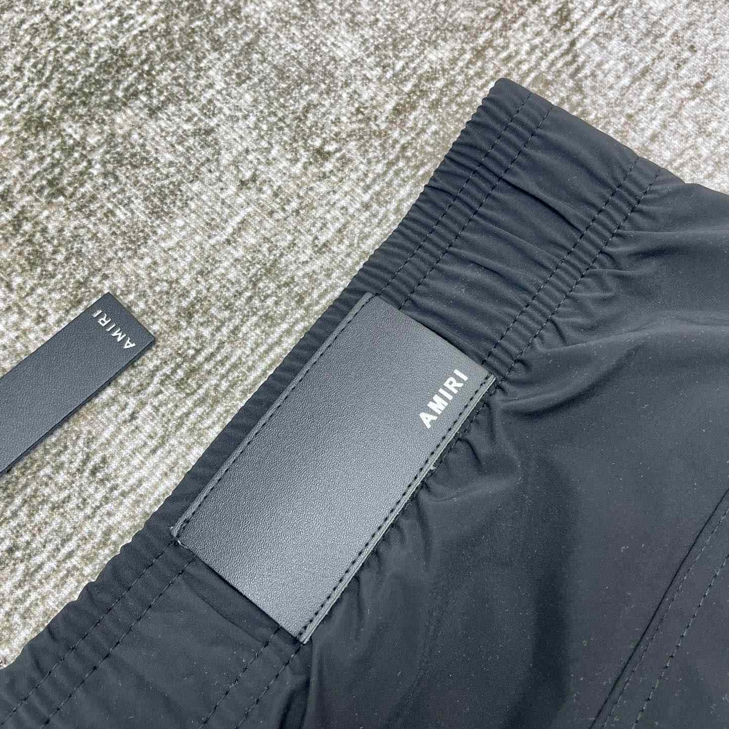 Amiri Staggered Swim Trunk - DopestKickz