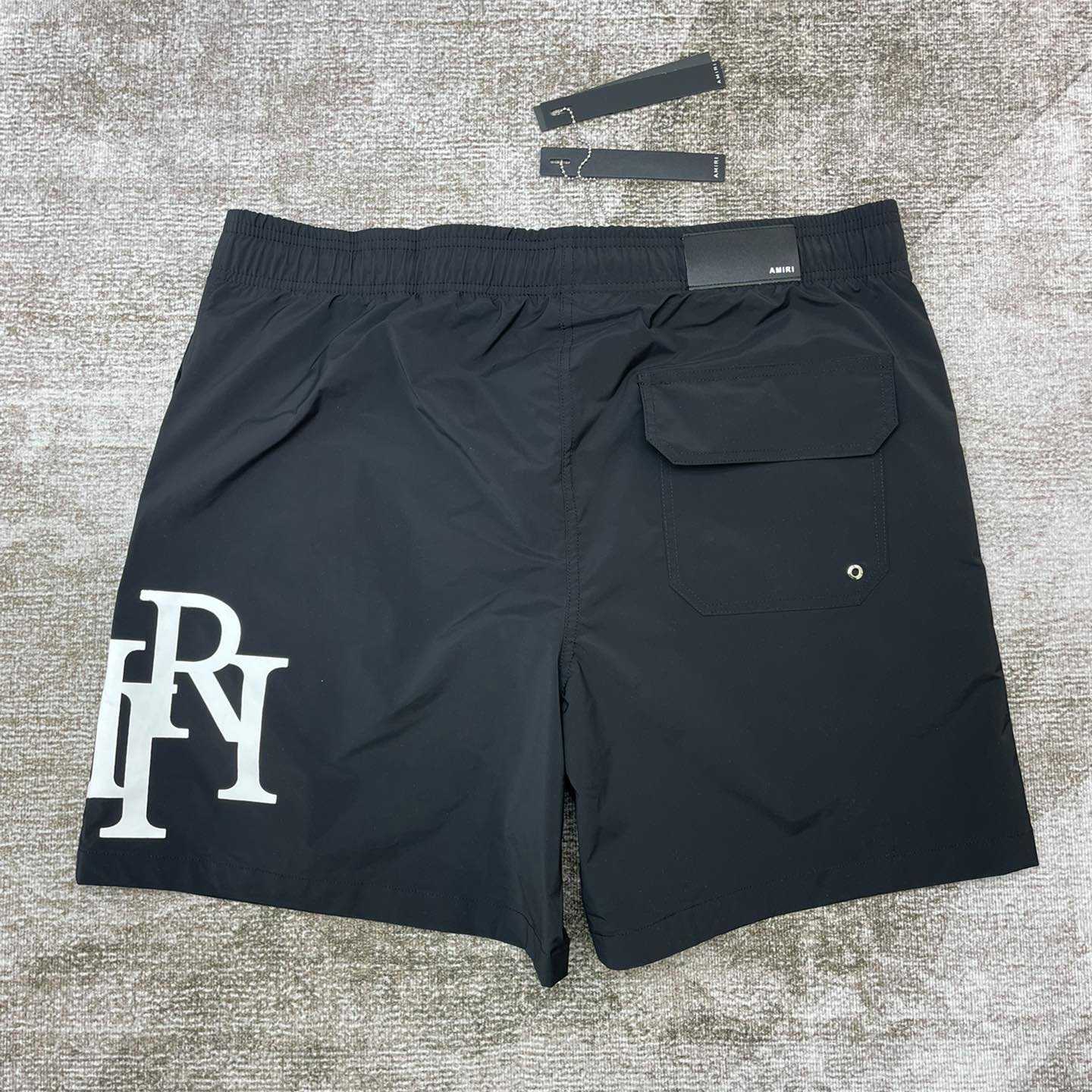 Amiri Staggered Swim Trunk - DopestKickz