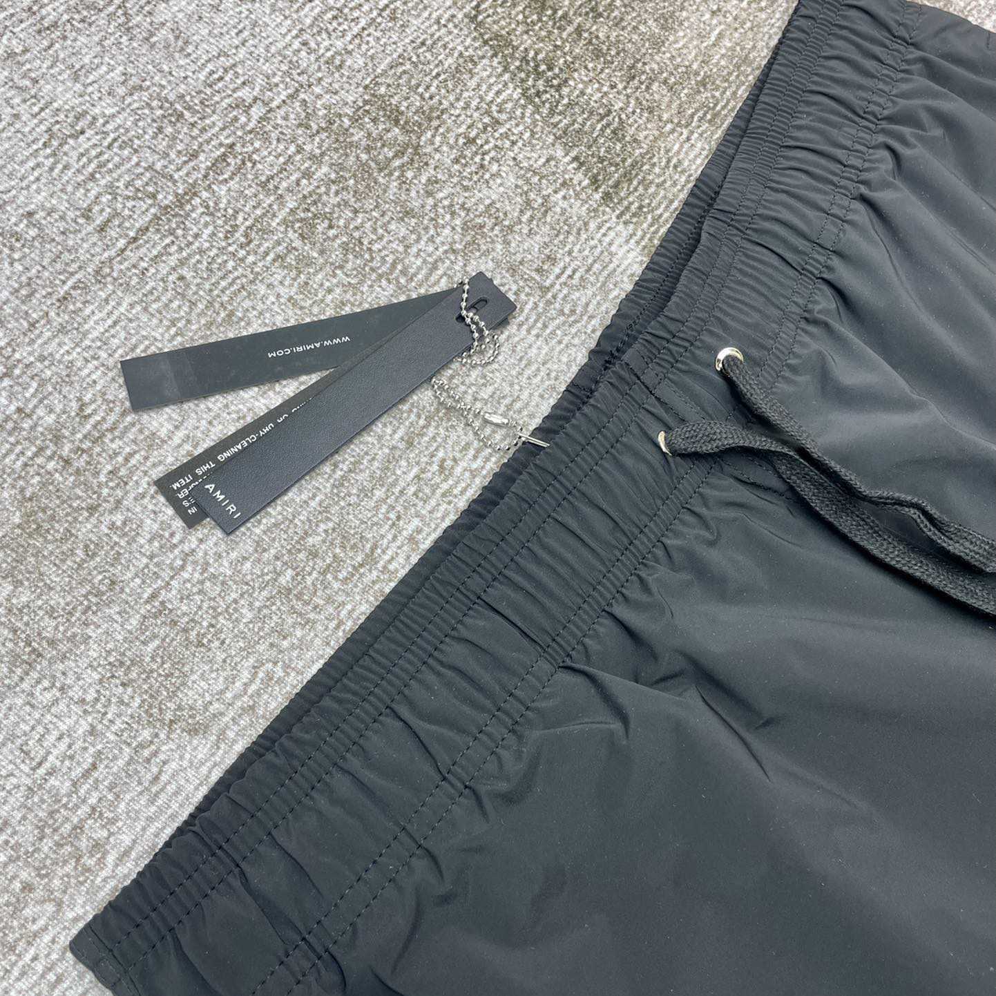 Amiri Staggered Swim Trunk - DopestKickz