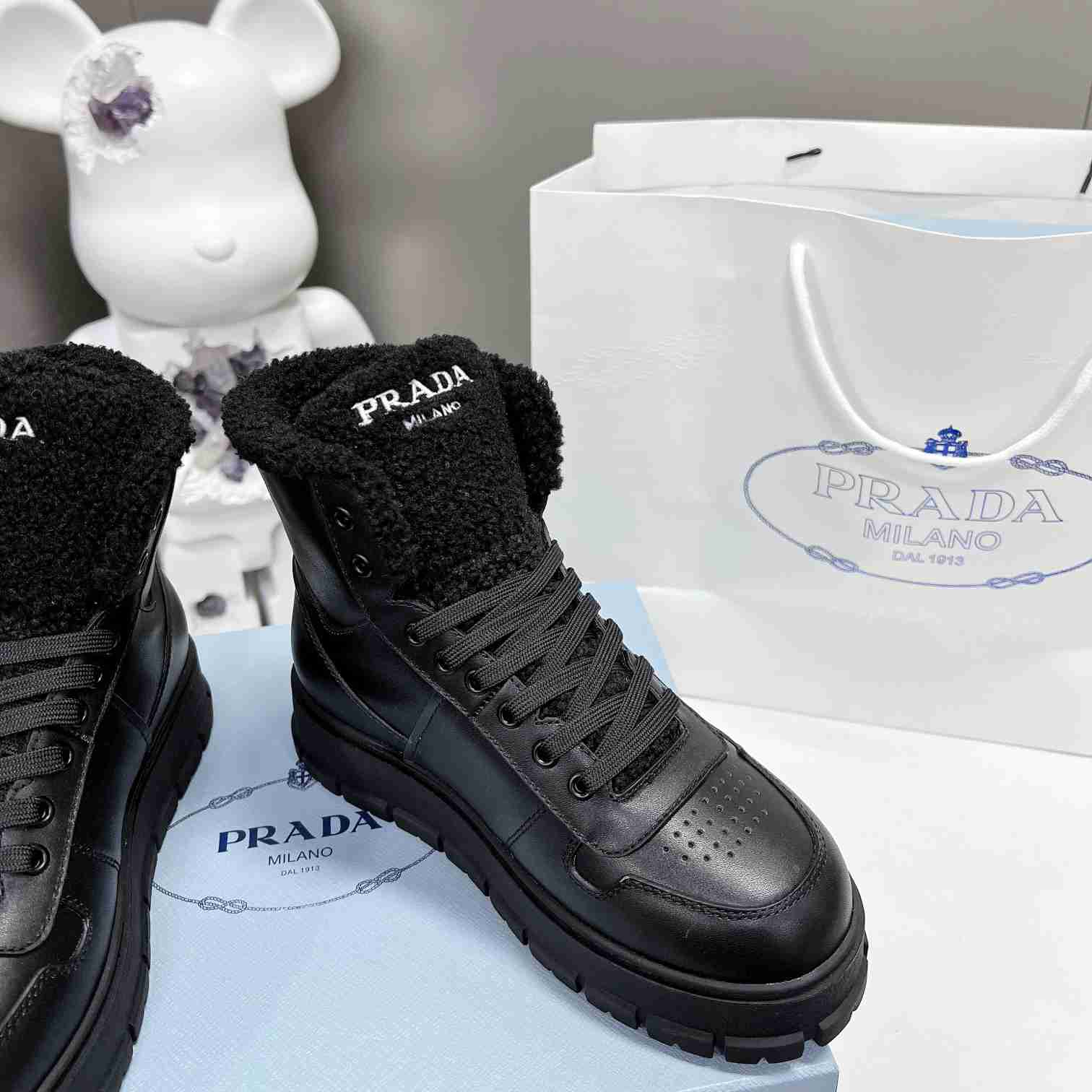 Prada Leather And Shearling High-top Sneakers - DopestKickz